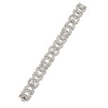A diamond flexible bracelet, designed as artulated panels of circular-cut diamond chevrons, each