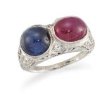 A ruby, sapphire and diamond ring, composed of an oval ruby cabochon and a circular sapphire