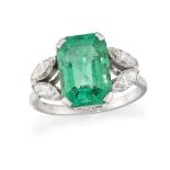 An emerald and diamond ring, the cut-cornered rectangular emerald to marquise-cut diamond two