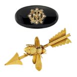 Two late 19th century brooches, comprising: a late Victorian gold bee and arrow brooch (damaged, one