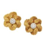 A pair of French, diamond earrings, each designed as a flower head with pavé diamond bombé centre