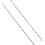 A platinum and diamond necklace, designed as a single row of collet-set circular cut diamond spacers