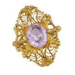 An early 19th century gold and pink foiled quartz panel later mounted as a ring, the oval pink