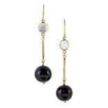 A pair of onyx and moonstone drop earrings, each designed as a spherical black onyx drop suspended