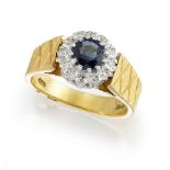 An 18ct gold, sapphire and diamond ring, the circular-cut sapphire within a single-cut diamond