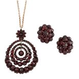 A 19th century suite of garnet jewellery, comprising: a faceted garnet pendant designed as a