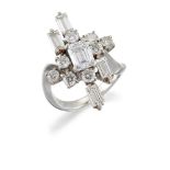 A diamond cluster ring, the cut-cornered rectangular diamond centre within a brilliant and