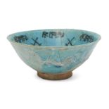 A Kashan turquoise glazed pottery bowl, Iran, 12th century, of conical form, under glaze painted