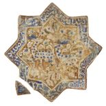 A Kashan star-shaped moulded pottery tile with animals and inscription, Iran, 12th century, the