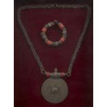 A coral set silver bracelet and necklace, Afghanistan, early 20th century, within a frame,