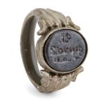 A hematite Kufic inscribed ring, Iran, 12th century and later, the white metal bezel set with the