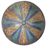 A Kashan lustre-painted radial design pottery bowl, Iran, 12th century, of lobed form, decorated