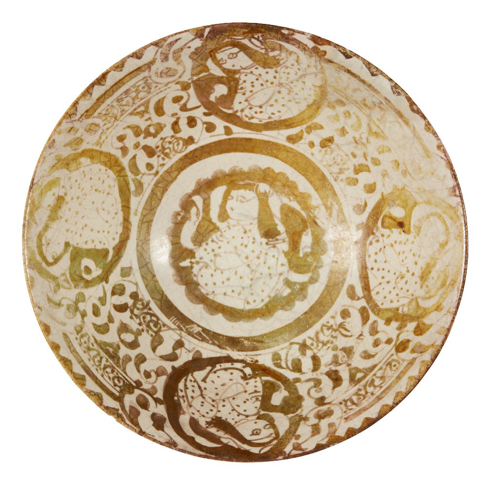 A lustre-painted pottery bowl with seated figures, Iran, 11th century, of conical form, the