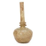 A glass bottle flask, Iran, 12th-13th century, honey-gold in colour, mould-blown, the bulbous body