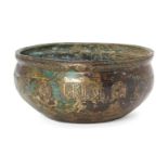 A Khorasan engraved bronze bowl, Iran, 12th century, of deep form, engraved to sides with a series