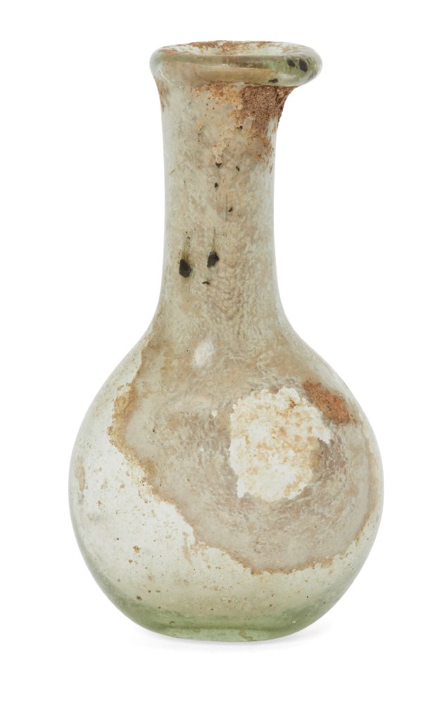 Six glass vessels including an unguentarium with tall cylindrical neck and applied trail, 15.2cm;