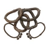 A group of bronze bangles, India, 18th-19th century, moulded with rope detail, each approx. 15cm.