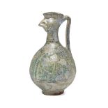 A Seljuk cockerel head pottery jug, Iran, 13th century, the body of squat globular form with