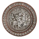 A repousee silver decorated copper plate, Tanjore, South India, circa 1880, of circular form, finely