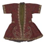 A child's robe, Iran, 20th century, gathered to waist, red with floral boteh design, edged with gilt
