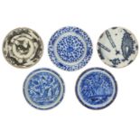 A group of five intact Safavid blue-and-white dishes, Iran, 17th century, of shallow form, painted