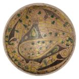 A Nishapur buffware pottery bowl with peacock, North East Iran, 10th century, of hemispherical