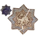 A lustre-painted moulded star shaped tile, Kashan, Iran, 12th century, decorated with deer and