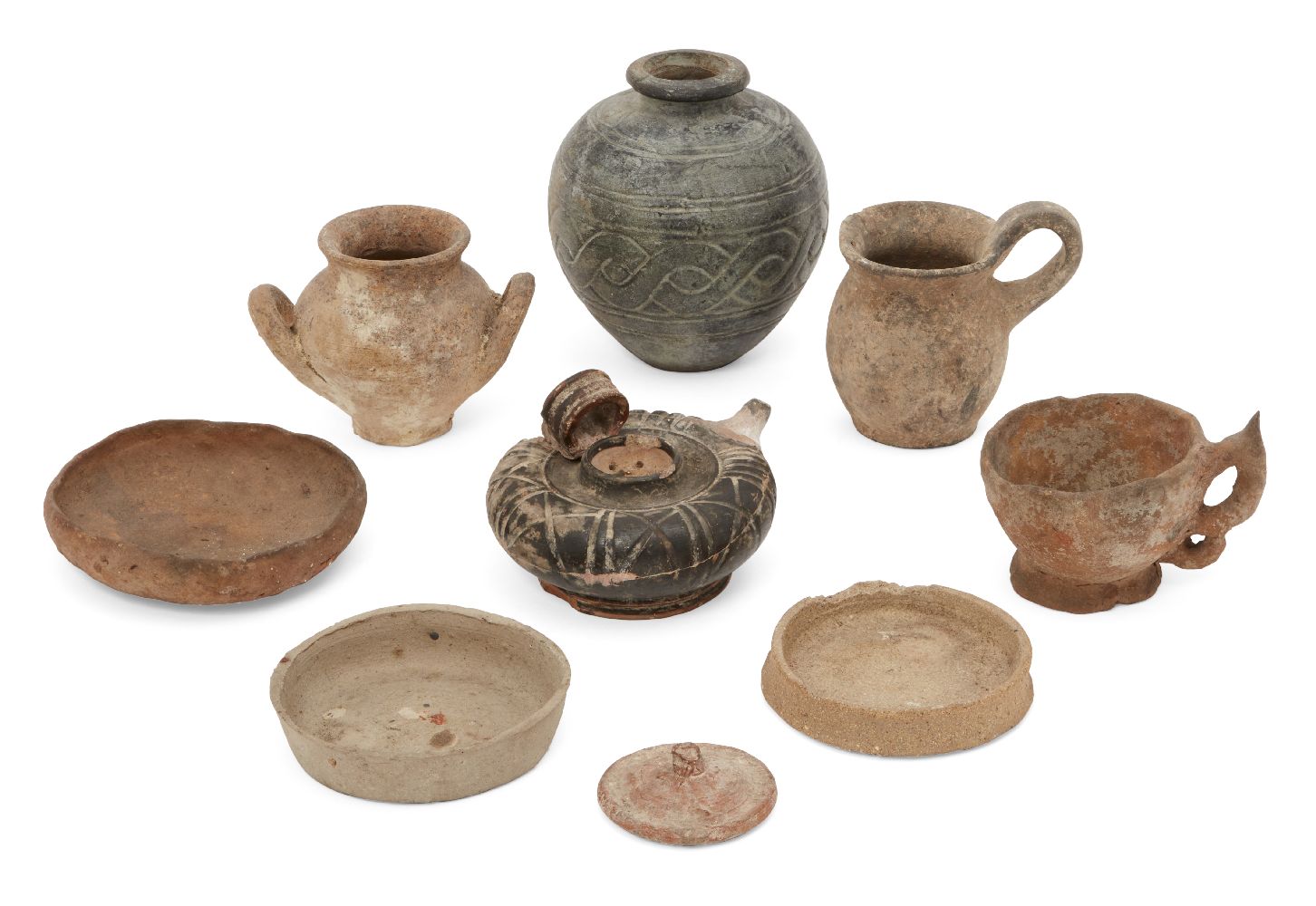 A group of ancient pottery vessels, 1st Millennium BC. and later, including a Greek black glazed oil