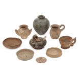 A group of ancient pottery vessels, 1st Millennium BC. and later, including a Greek black glazed oil