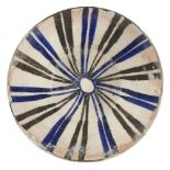 A Kashan blue, black and white conical pottery bowl, Central Iran, 13th century, on vertical foot,