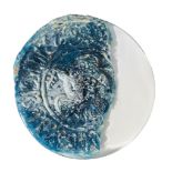 A Ghaznavid blue glass moulded roundel fragment, Iran, 12th century, of circular form, moulded