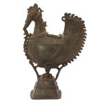 A bronze bird incense burner, Deccan, India, 19th century, on a square tiered base, with moulded