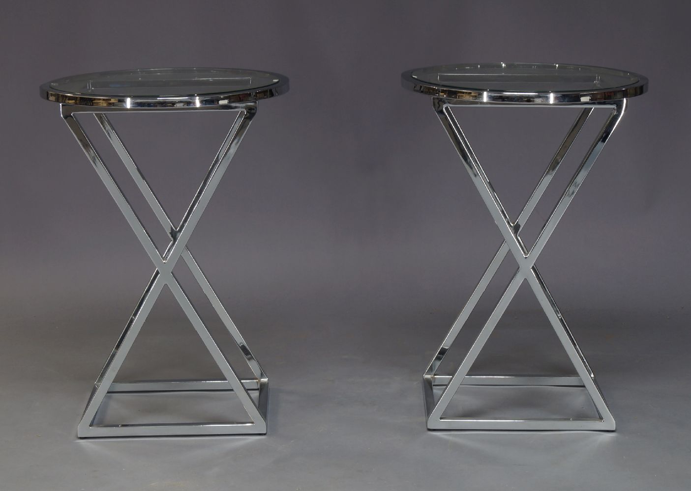 AMENDMENT: Please note VAT is charged on the hammer price for this Lot. A pair of chromed and glass