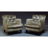 A pair of button back armchairs, of recent manufacture, upholstered in green velvet fabric, with
