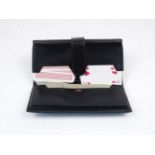 A Hermes bridge wallet, 1980's, of typical form, designed in leather, containing two decks of cards,