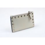 A Valentino Garavani 'Rockstud' calfskin leather purse, the folding body with six card holder slots,