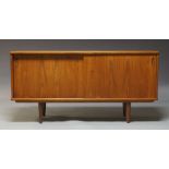 Dyrlund, a teak sideboard, c.1960, with two sliding doors enclosing storage space, a drawer and