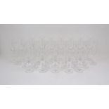 A set of nine Riedel wine glasses, of typical elongated form, 24.5cm high, with a further set of