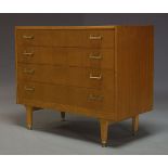 G Plan, an oak chest of drawers, with four graduated drawers, having brass handles, raised on