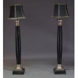 A pair of modern steel standard lamps, of recent manufacture, each of tapered columnar form,