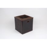 A Japanese stained wood hibachi of square form with copper interior, the wooden structure held