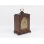 An Asprey mantle clock, 20th century, the rectangular form wooden case enclosing a brass face,