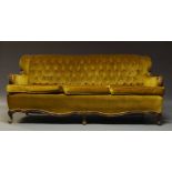 A three piece sofa suite, comprising a two seat sofa and two armchairs, early 20th Century,