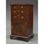 A George I walnut bachelor's cabinet, with feather banded fold over top, above three drawers and