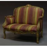 A Louis XV style green painted and parcel gilt sofa, late 20th Century, the shaped back, centred