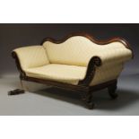 A Victorian mahogany framed sofa, with serpentine shaped backrest and scrolling carved armrests,