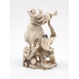 A Japanese carved ivory figure group, late 19th century, modelled as an octopus attacking three