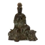 A Chinese bronze figure of Guanyin atop and elephant, late Qing dynasty, Guanyin modelled seated
