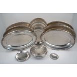 A quantity of silver plate, by Christofle, comprising two large, oval serving dishes with decorative