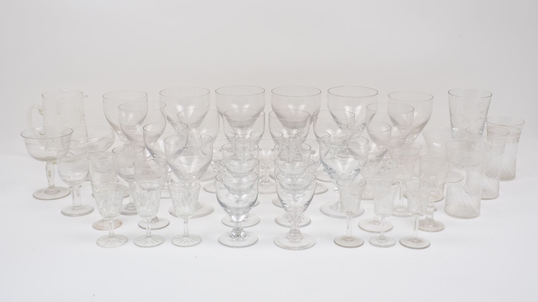A large collection of drinking glasses, to include 19th century rummers of rounded funnel form